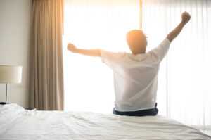 man-wake-up-and-stretching-in-morning-with-sunlight-300x199 (1)